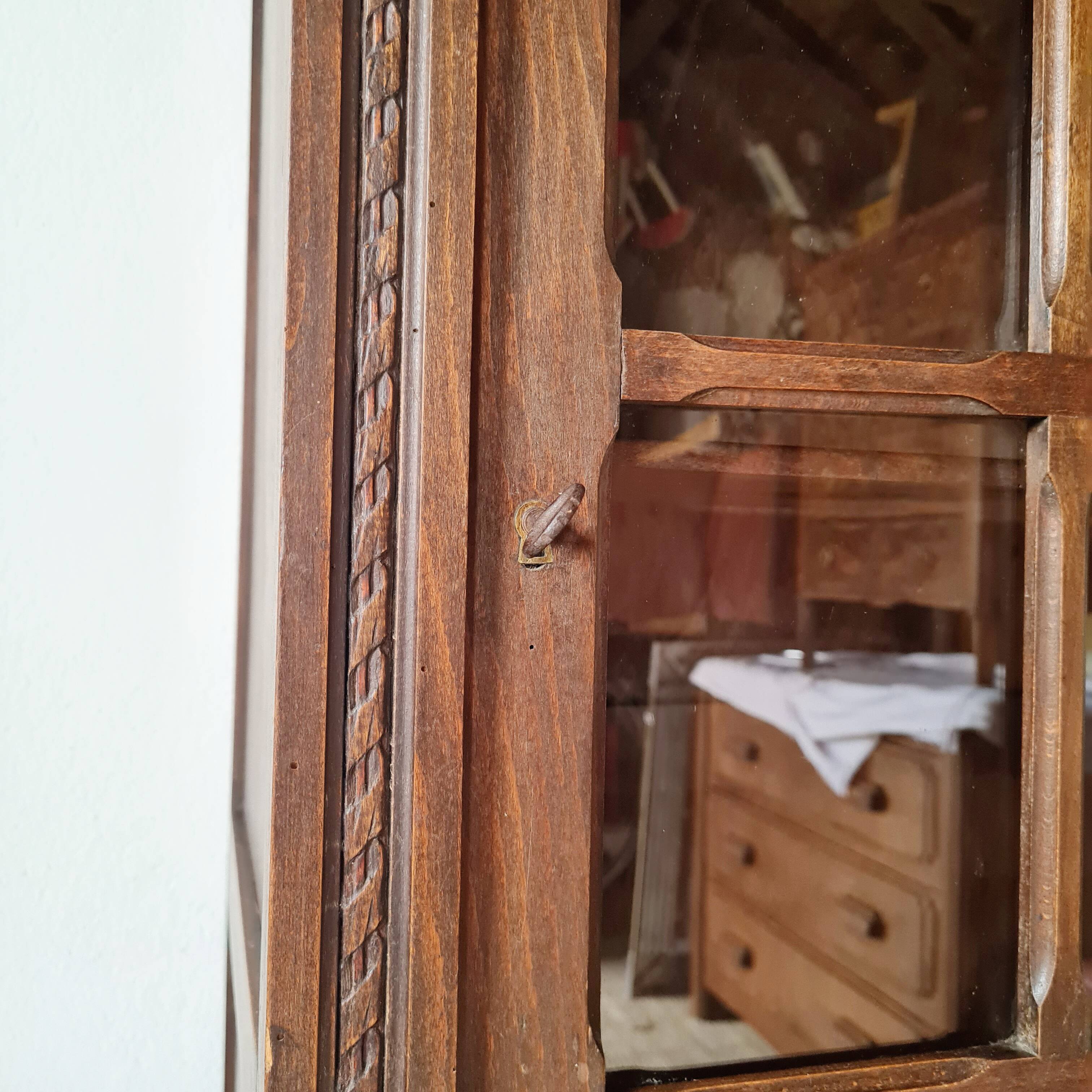 Old glass-fronted library in solid wood
