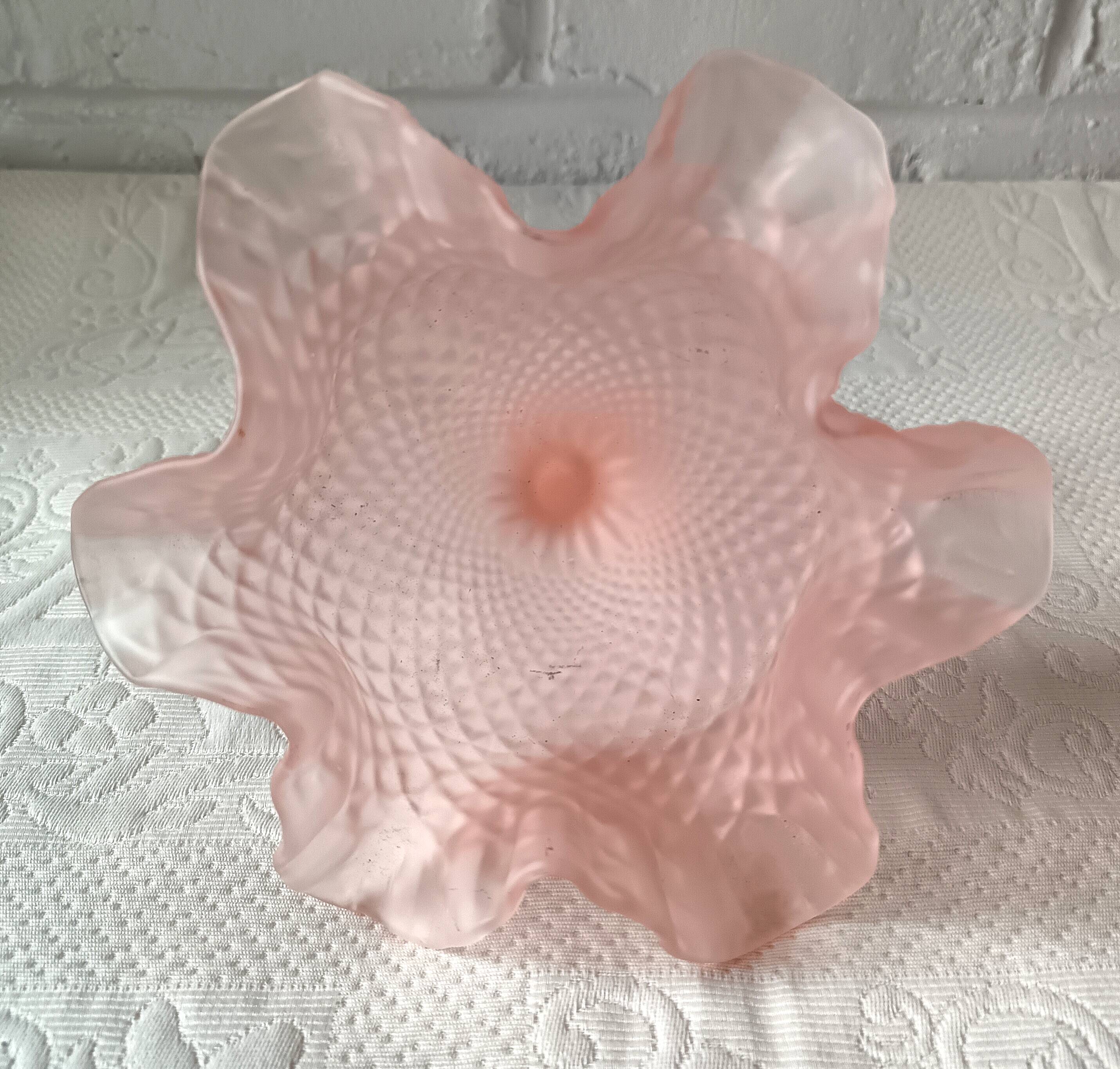 Small pink glass bowl on shabby foot, empty pocket