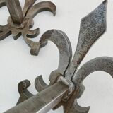 Pair of vintage steel fleur-de-lys andirons
