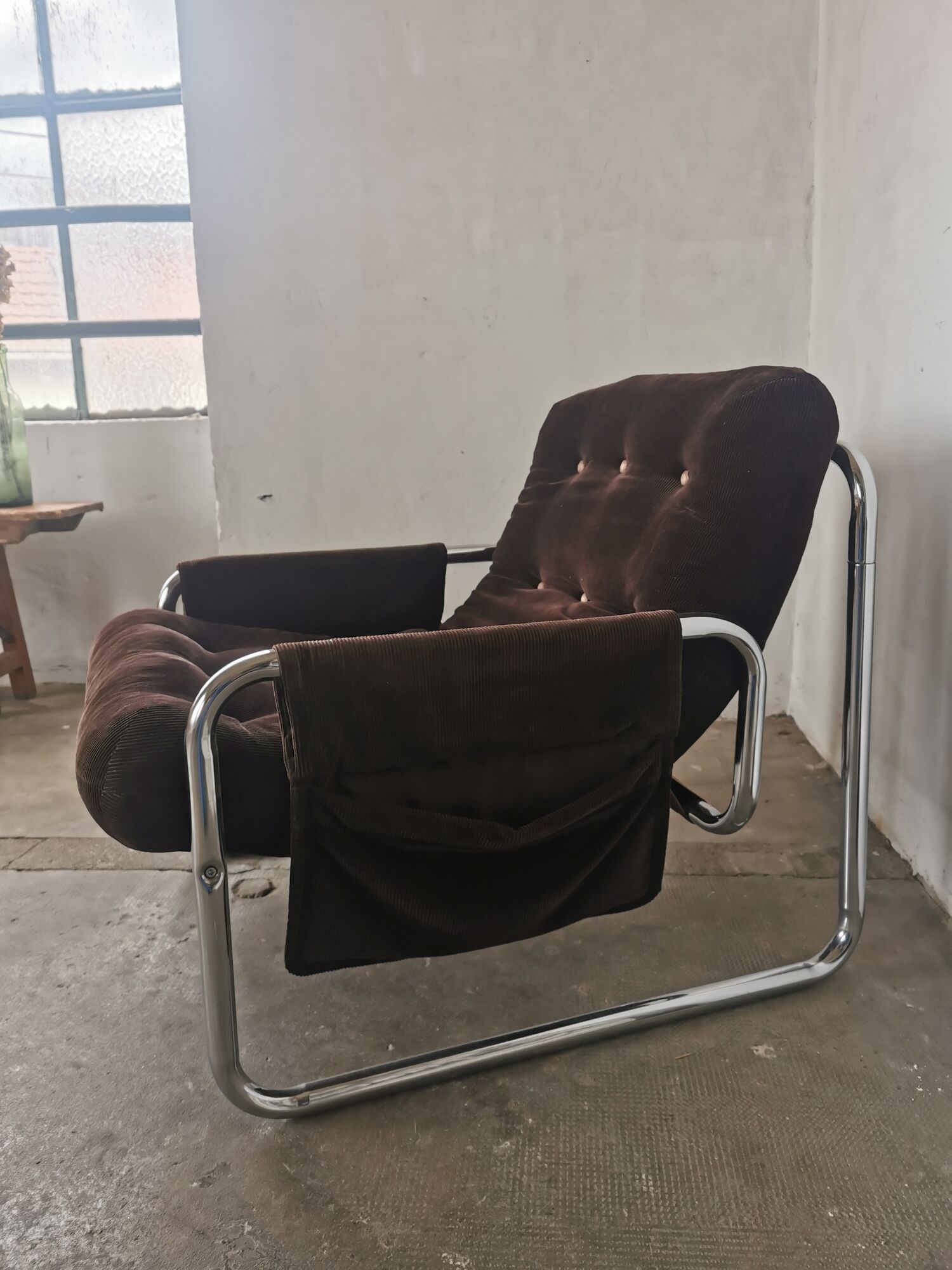 Velvet and tubular metal armchair 1980