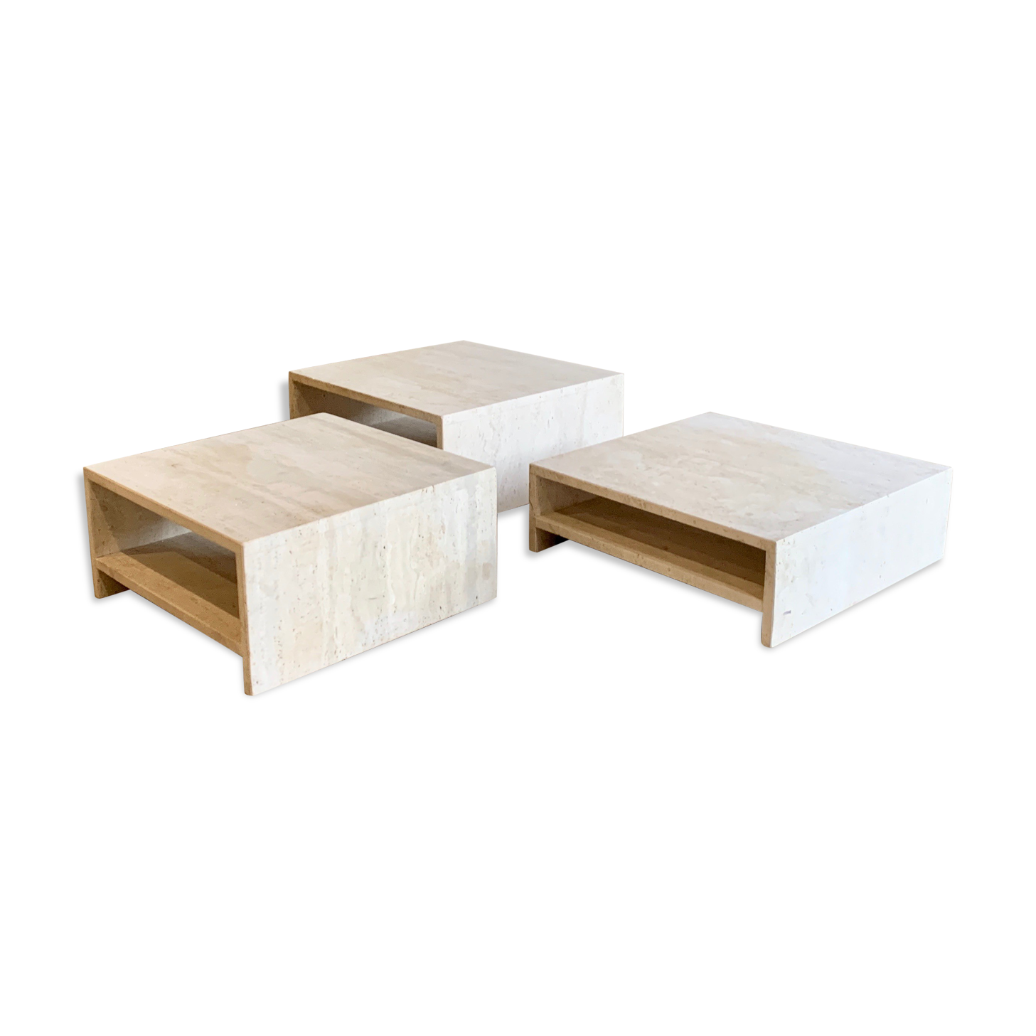 Modular square coffee tables in softened travertine