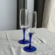 Set of 6 blue-footed champagne flutes; 3 pairs of designs.