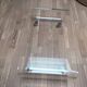 Design coffee table from Habitat in transparent plexiglass, mounted on wheels.