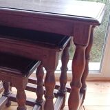 Nesting tables in oak wood. Turned wooden legs.
