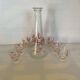 Carafe and 6 matching glasses in red and gold.