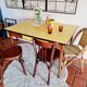 Old wooden farmhouse table and yellow formica top