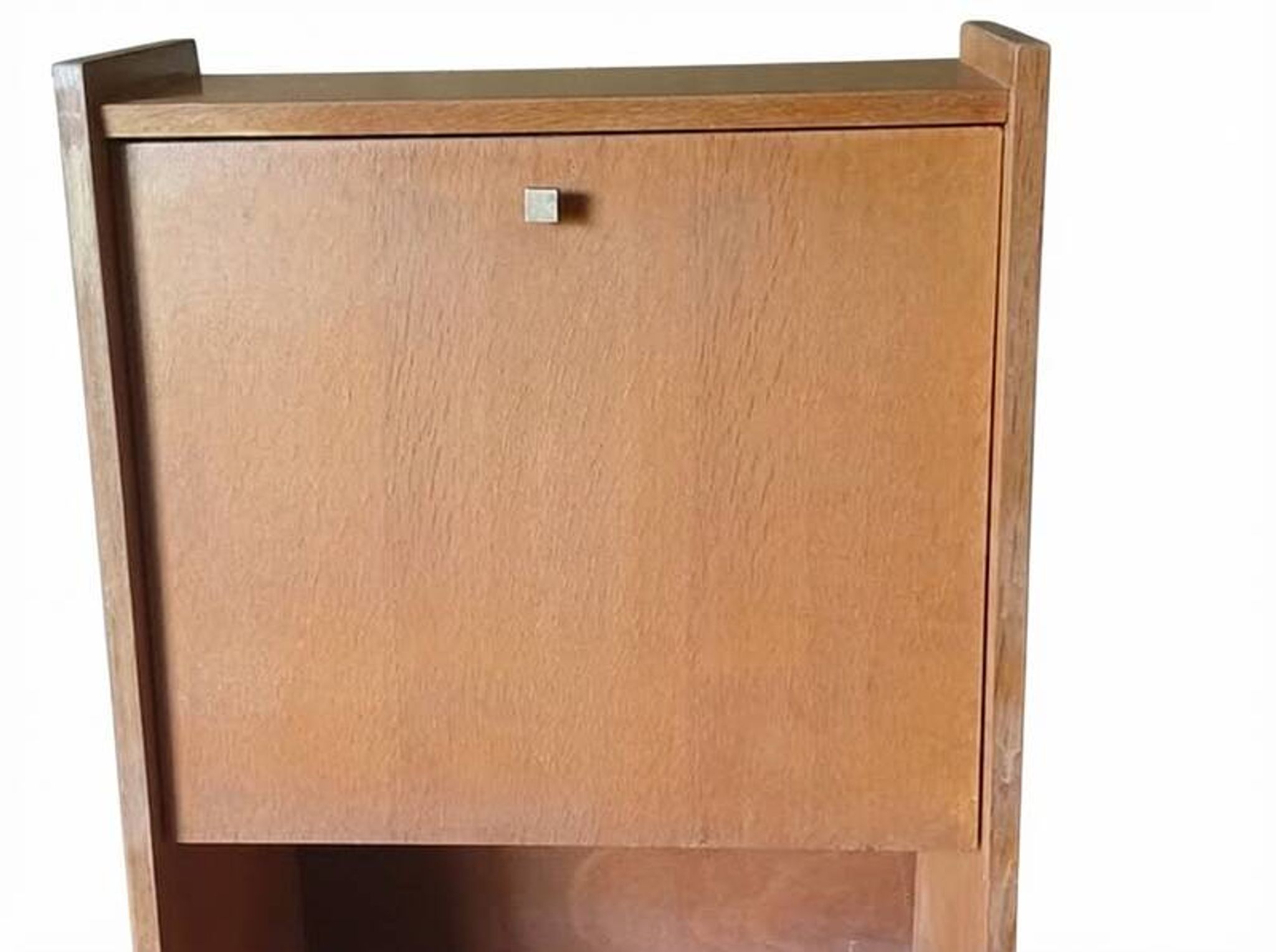 Vintage 1960s secretary desk with an angled design, light wood, and tapered legs.