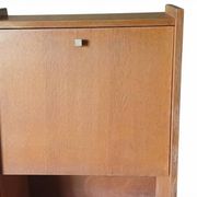 Vintage 1960s secretary desk with an angled design, light wood, and tapered legs.