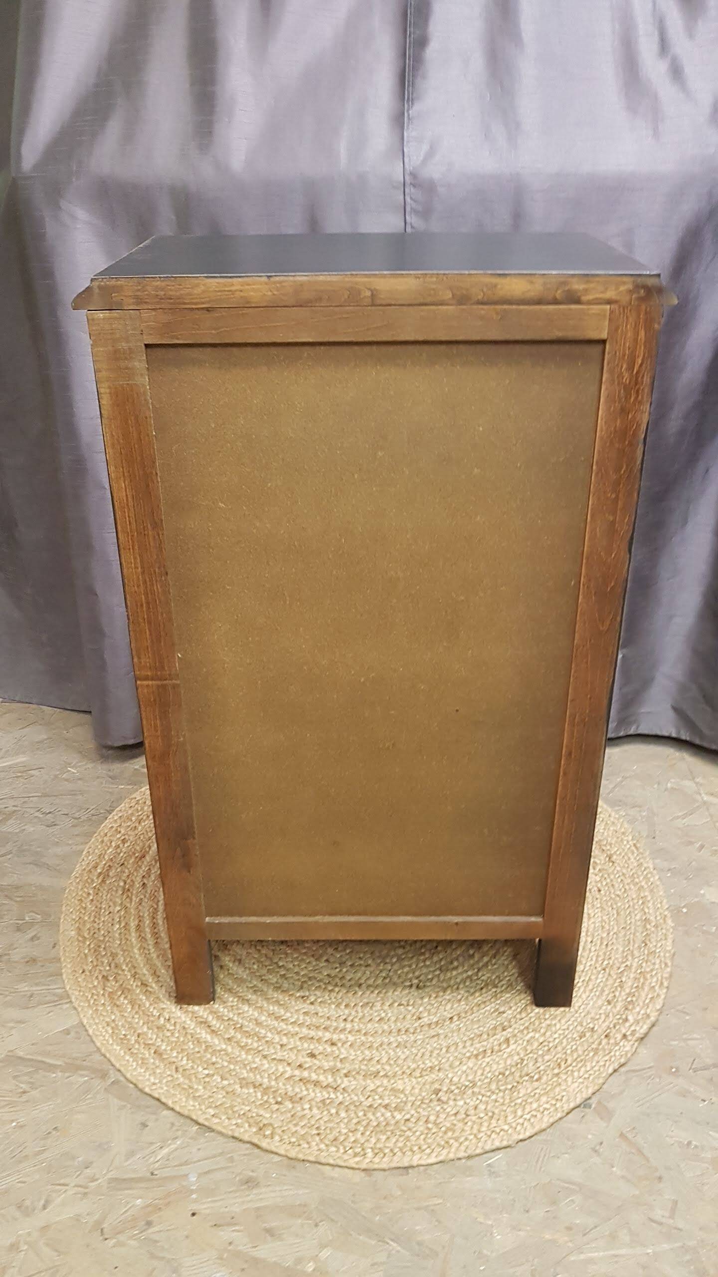 Cherry wood chest of drawers with 5 drawers in aged black.