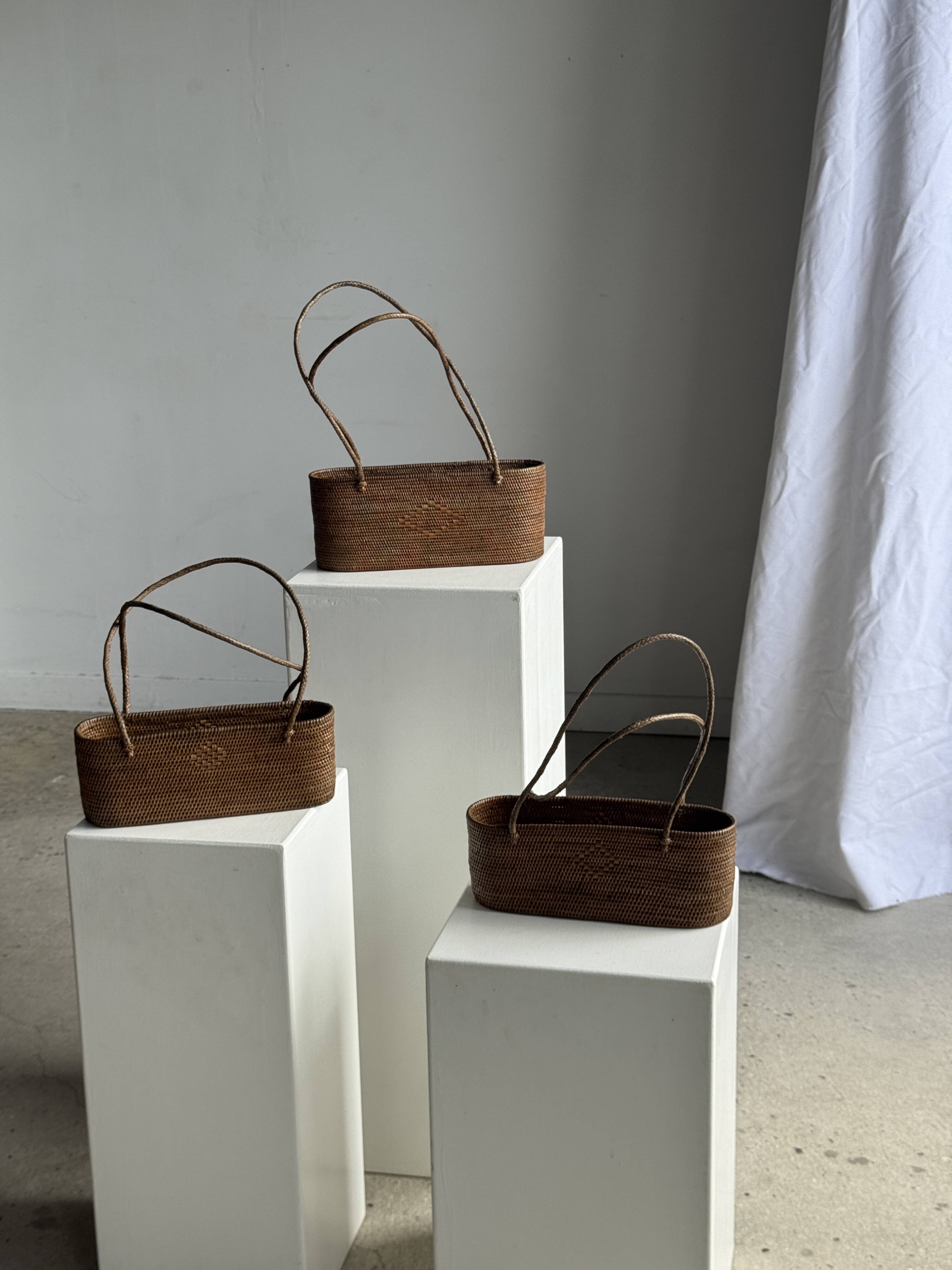 Small oval basket with long handles, traditional Indonesian L28xH10