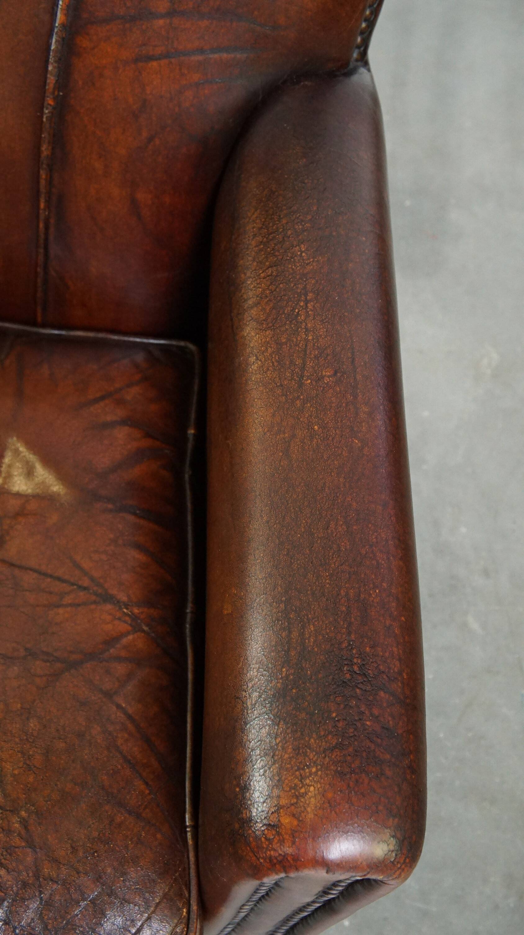 A vintage-style armchair with character, upholstered in beautifully patinated sheepskin.