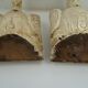 Deux ornements d'applique en bois sculpté et laqué crème,  représentant des cygnes
