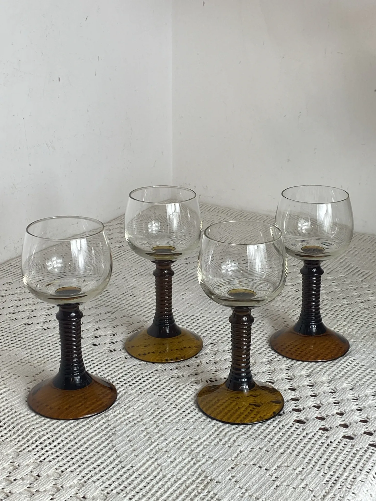 Footed glasses of the Roemer type, amber colour