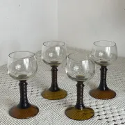 Footed glasses of the Roemer type, amber colour
