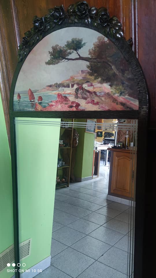Overmantel mirror from the decorative arts period, 1929, in hammered wrought iron, 75x160cm