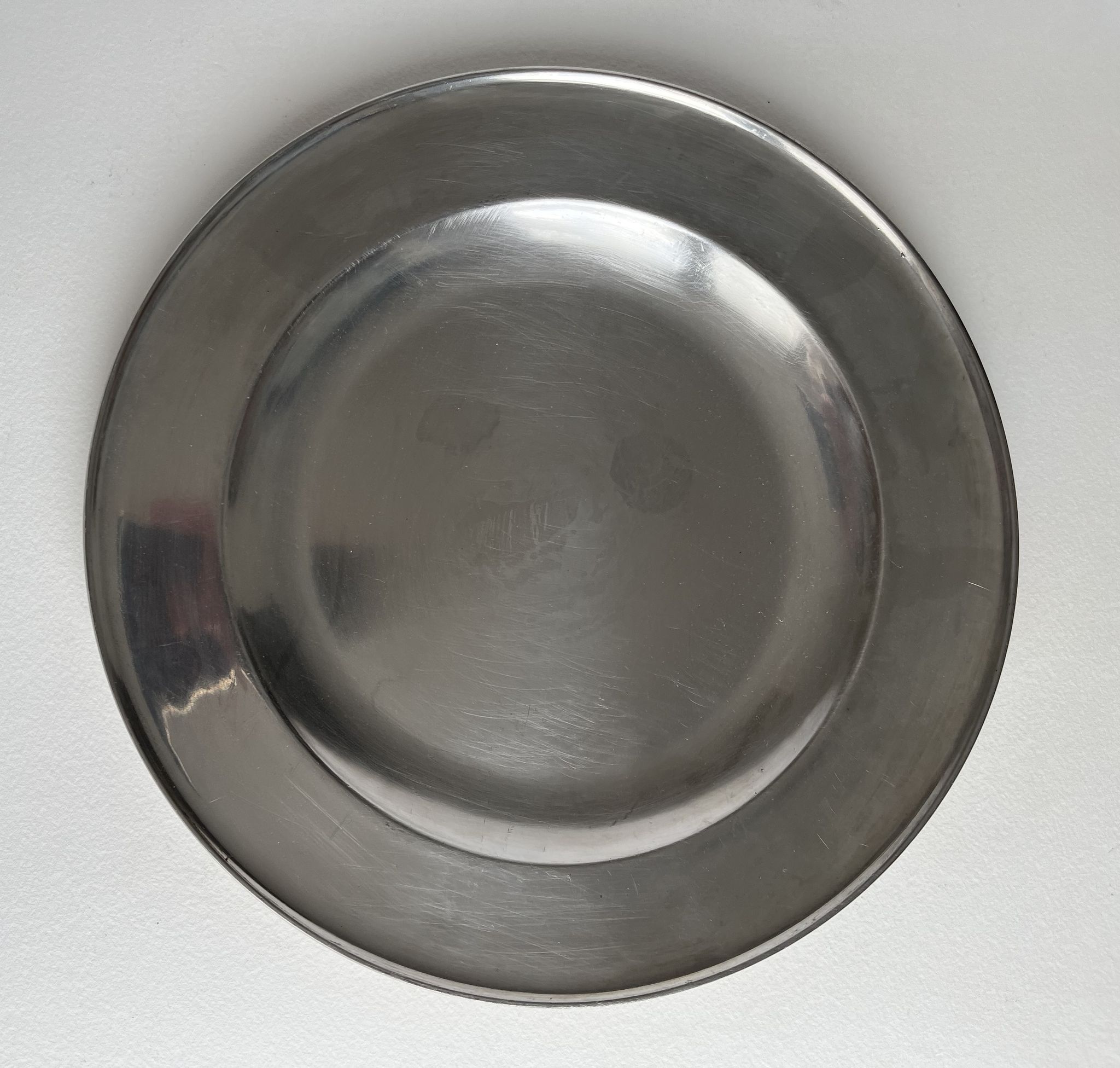 Circular pewter dish