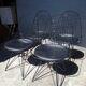 Set of 4 Eames chairs in metal