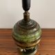 Art Deco table lamp in patinated bronze with eagles holding a globe, France 1940.