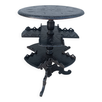 Napoleon III period gueridon in blackened wood with foliage decoration