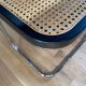 Banc en cannage, bois noir et métal chromé modèle Panchira
