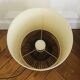 Table lamp with rattan base and papier-mâché hat