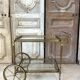Rolling bar cart in brass and bronze circa 1960