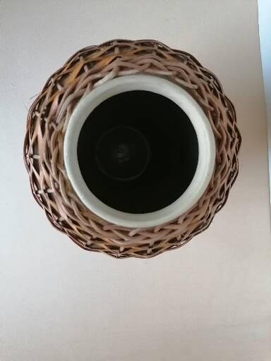 Rattan vase on ceramic
