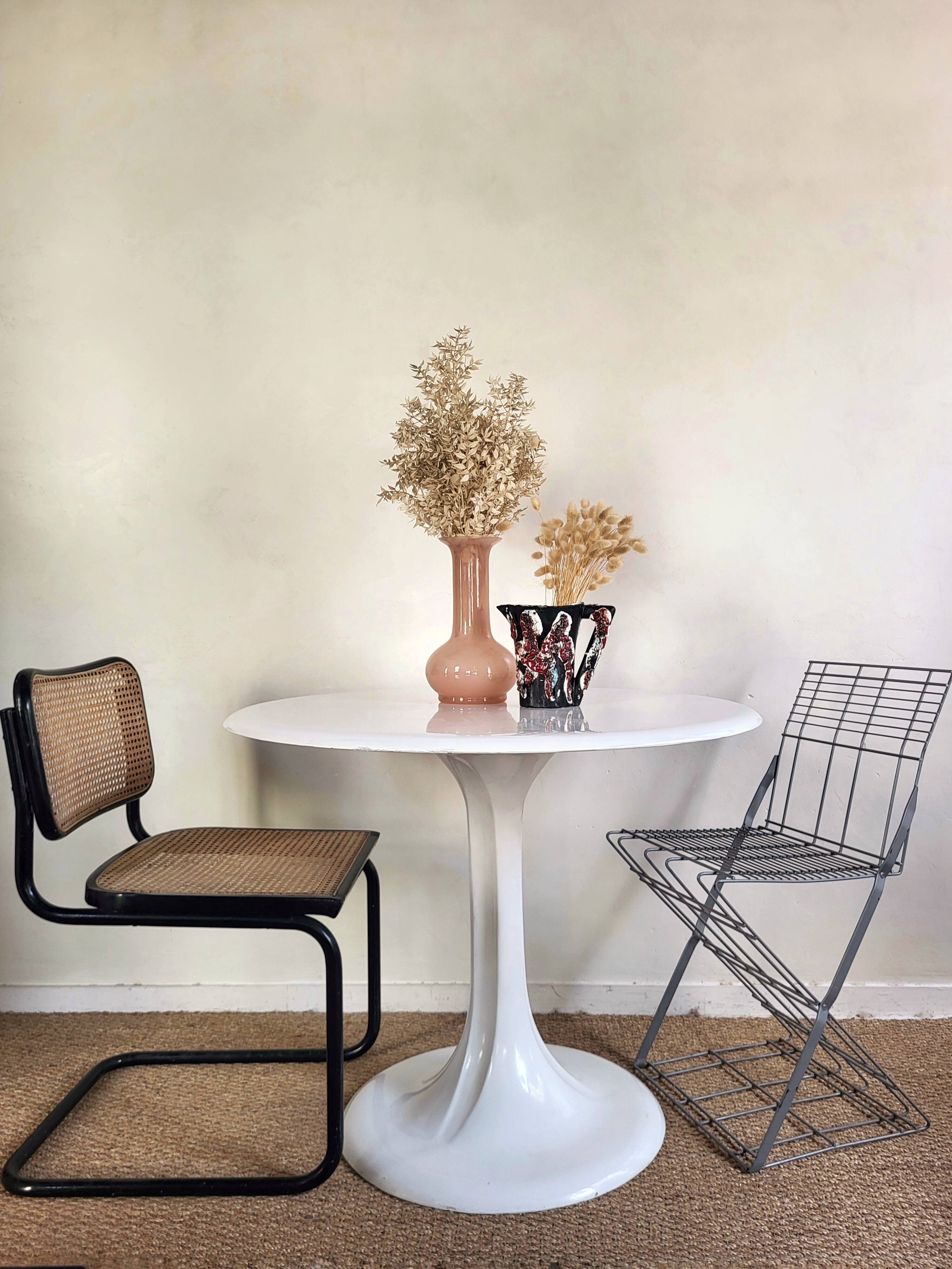 Round tulip-shaped dining table