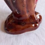 Ceramic vase, brown background, decorated with stylized tulips