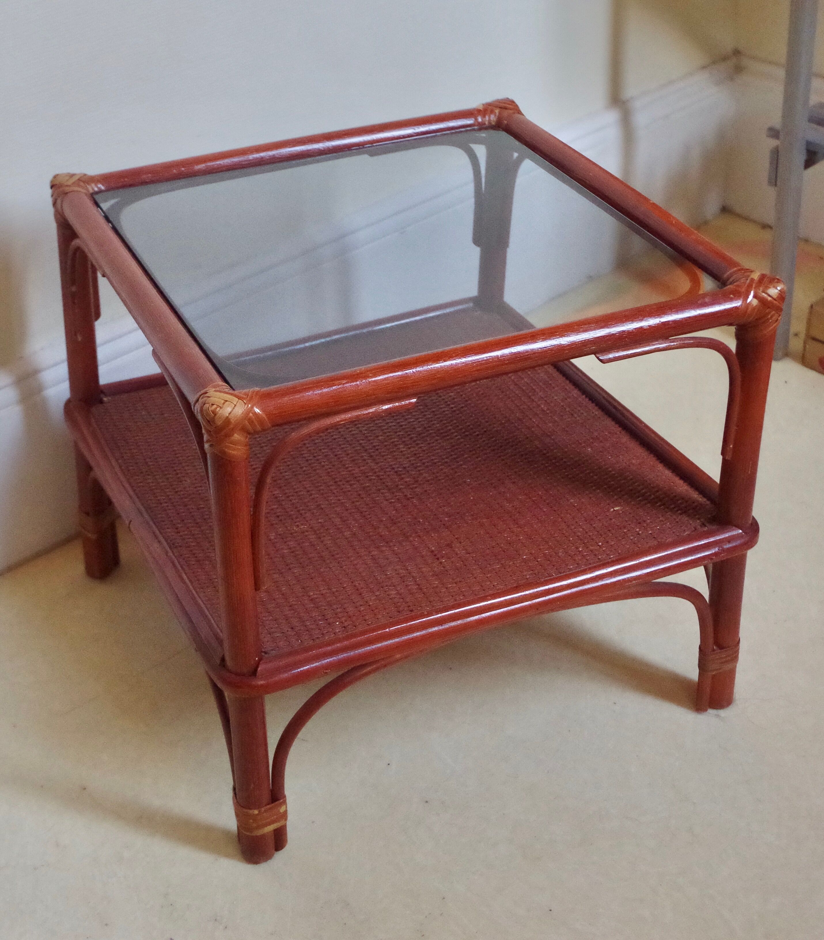 Varnished rattan coffee table and smoked glass top