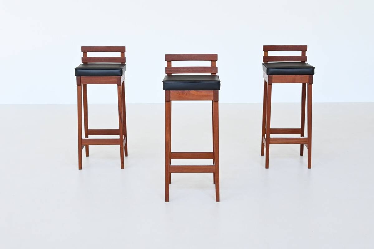 Erik Buck set of three bar stools in teak and leather Dyrlund Denmark 1960