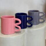 Ceramic mug with wave handle