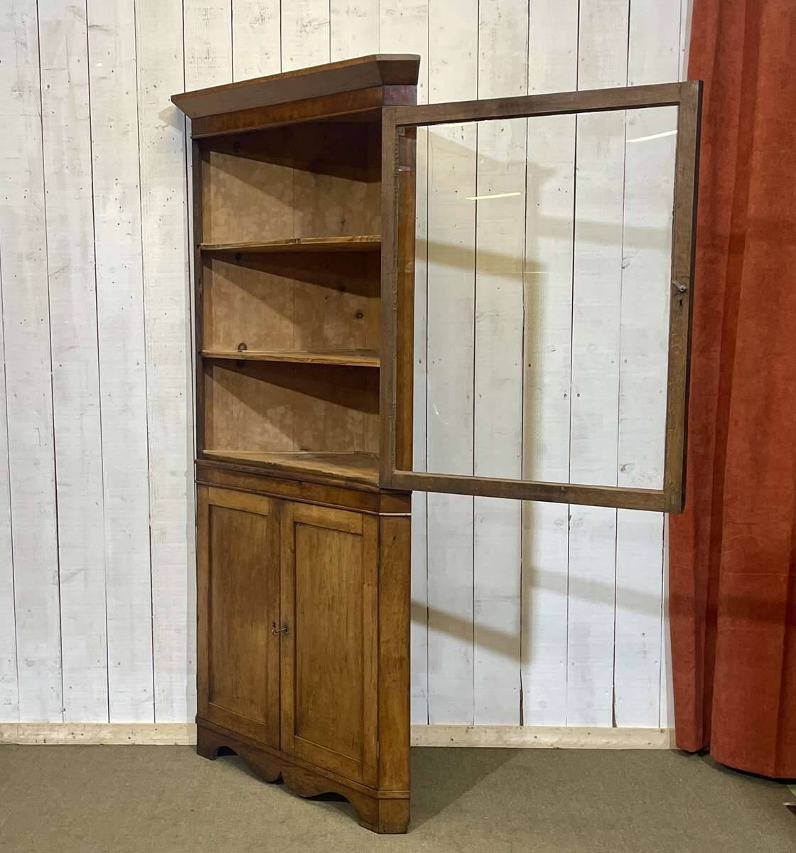 19th-century English corner cabinet in oak, mahogany, and fir.