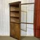 19th-century English corner cabinet in oak, mahogany, and fir.