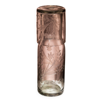 Carafe and glass made of blown and engraved glass.