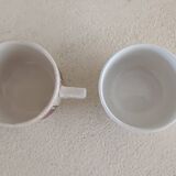 2 mismatched iron earth cups