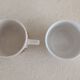 2 mismatched iron earth cups