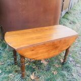 Extendable round table in walnut wood 1930