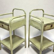 Copy of a pair of patinated metal bedside tables.