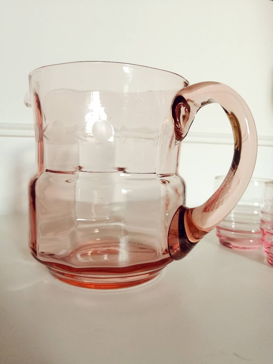 Pitcher and 2 glasses in pink glass