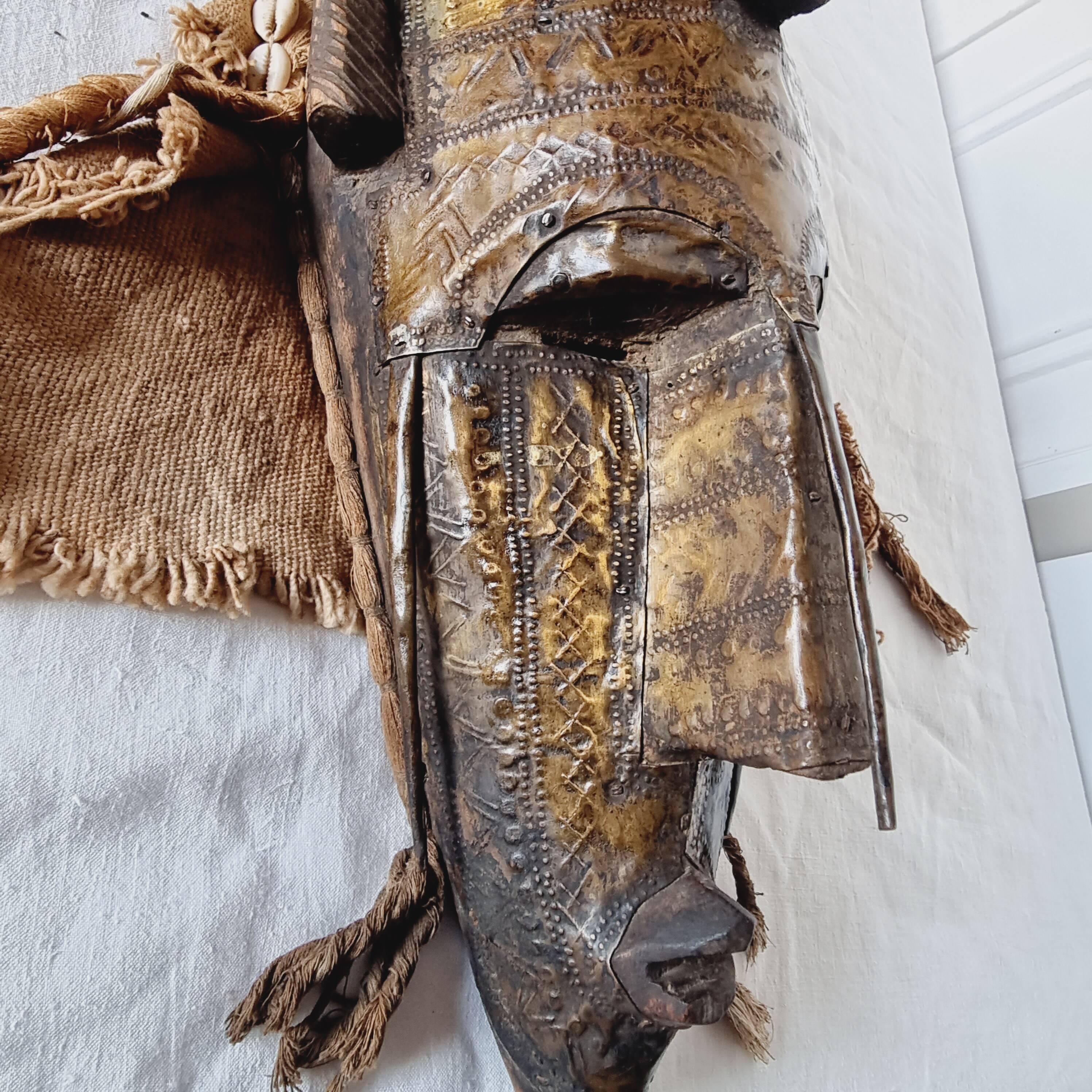 African mask from Mali from the N'Tomo tribe of Marka covered in chiseled brass