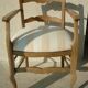 Fauteuil à accoudoirs dossier bas