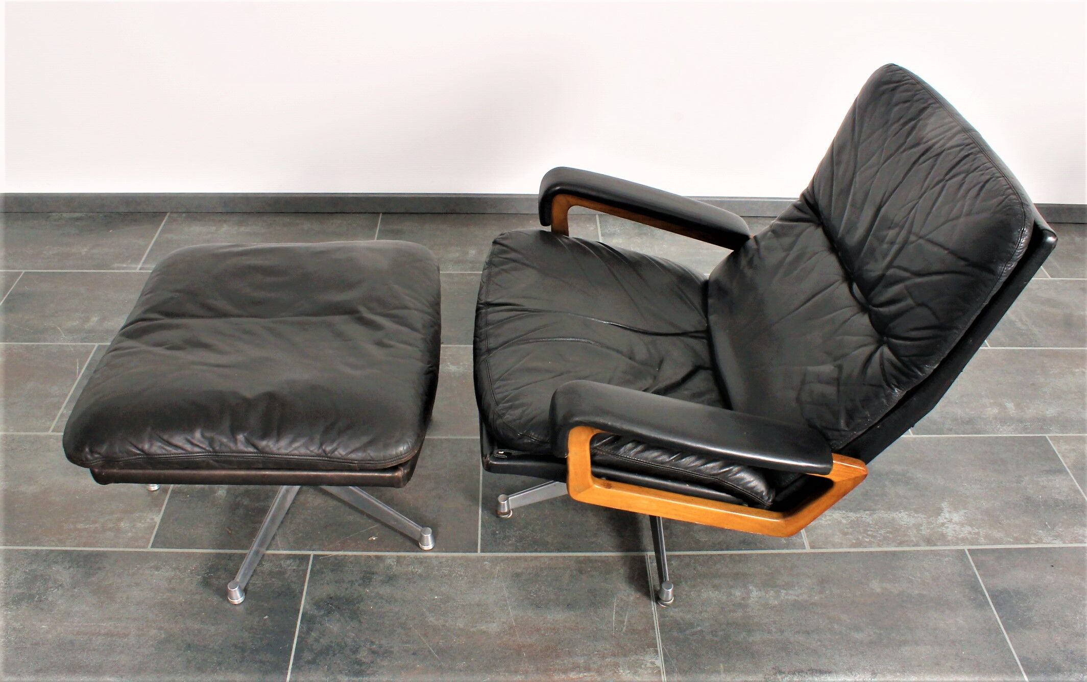 Armchair and footstool by André Vandenbeuck for Strässle in black leather