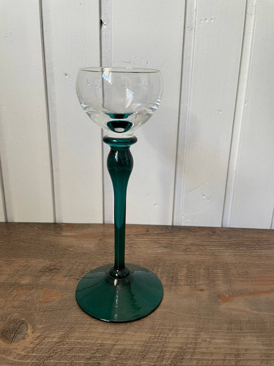 crystal wine glass on green stem