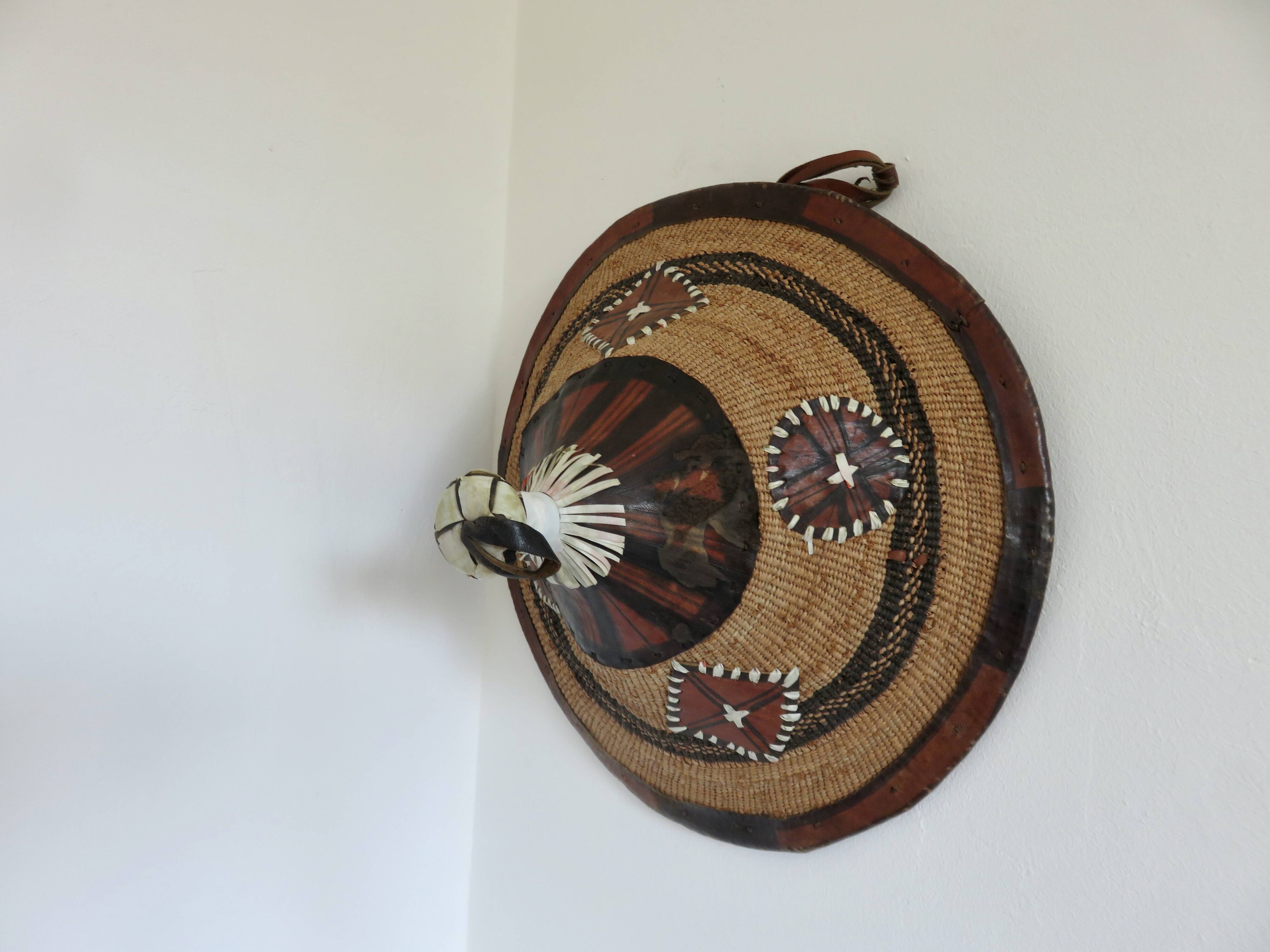African conical hat, Fulani, in leather and braided rope, 1900, wall decoration