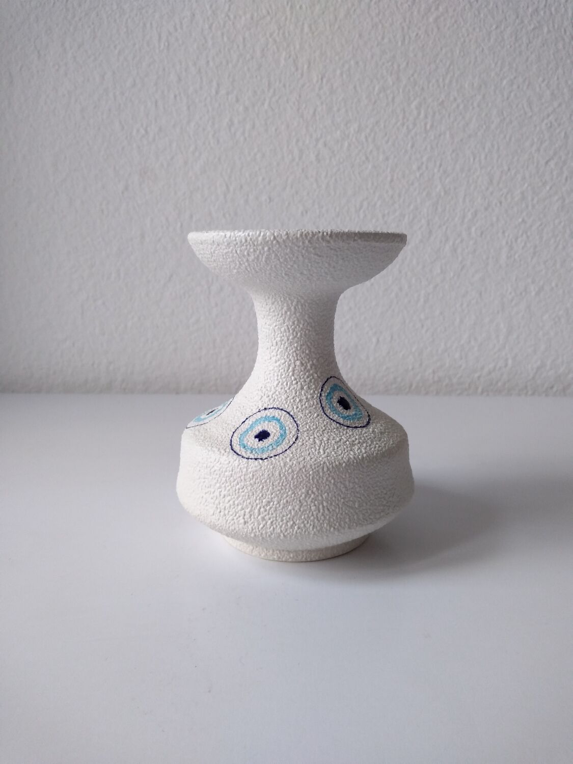 White and blue ceramic vase with italian relief