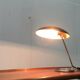 Metal table lamp model 6761 from the mid-century German period by Christian Dell for Kaiser Leuchten, 1960s.