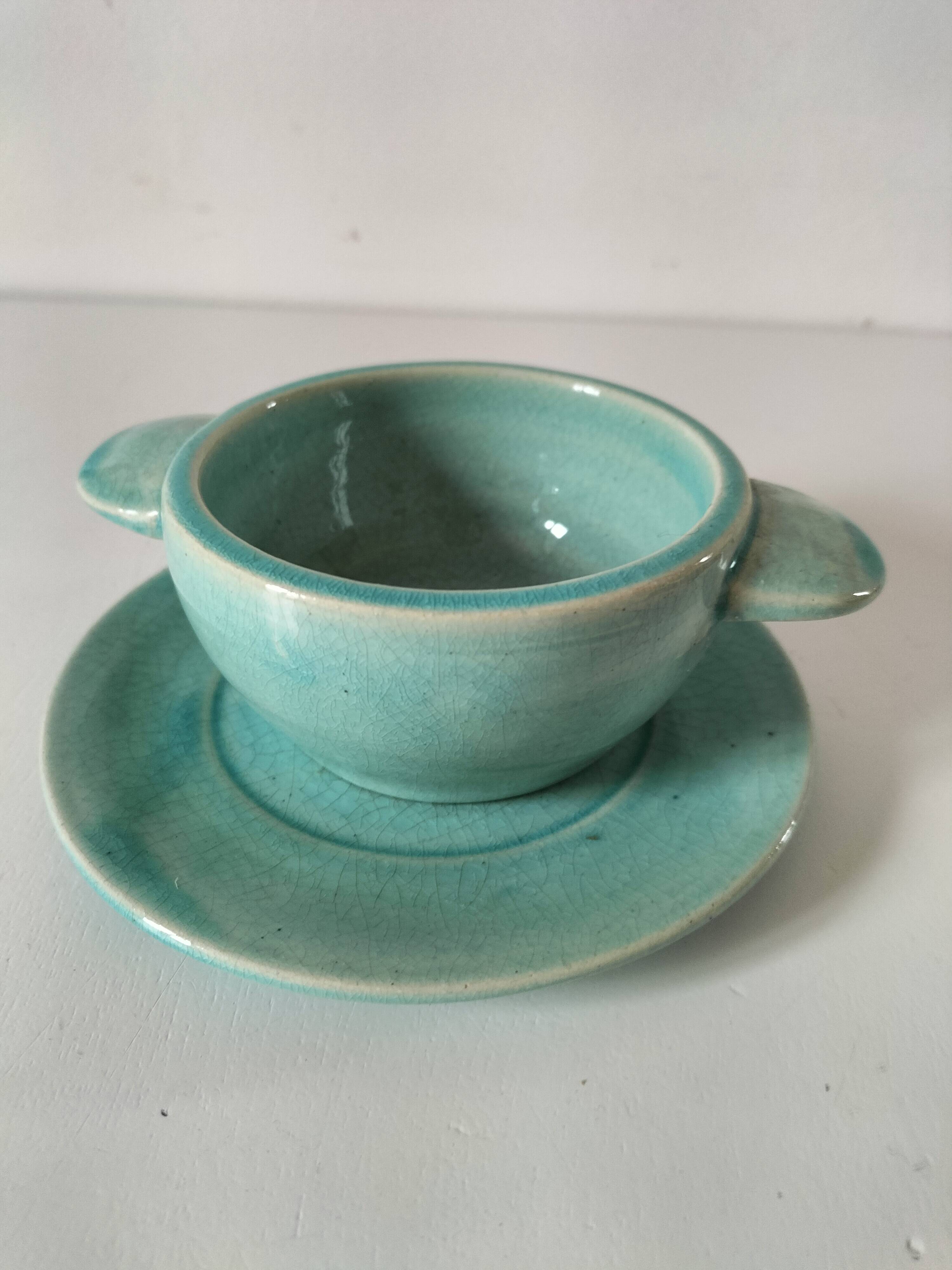 Earthenware bowl and saucer in glazed water green ceramic.