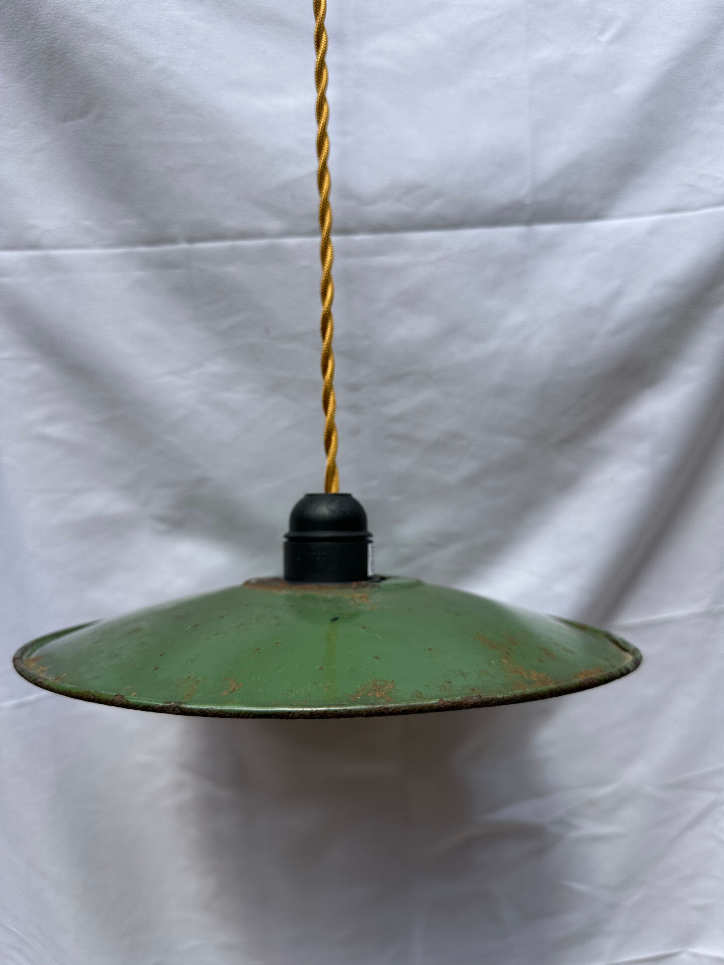 Old green and white enamelled sheet metal suspension