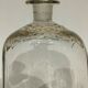 Glass bottle decorated with gold motifs